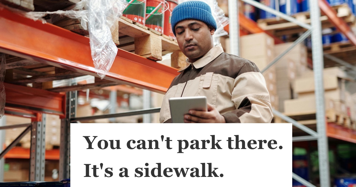 man in blue hat working in a store