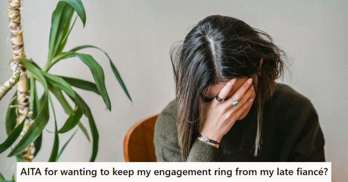 Woman holding her head and sitting sadly