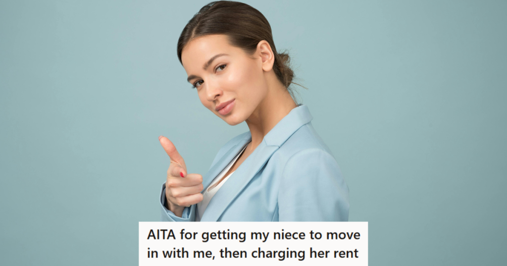 Woman in blue coat doing a thumbs up