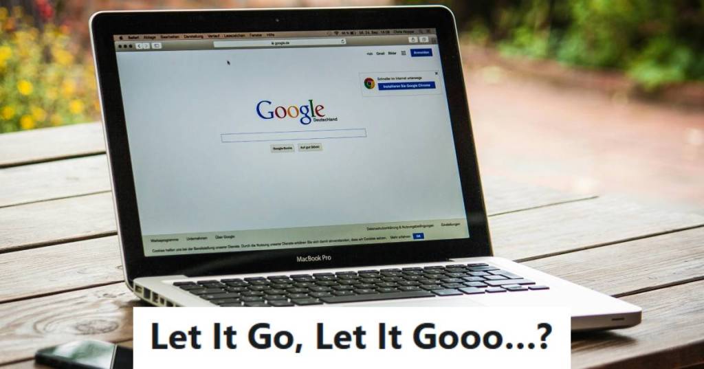 Computer sitting outside on the picnic table