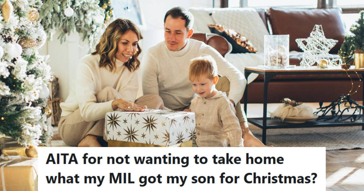 Husband and wife watching their 18 month old son watching gifts from his grandma