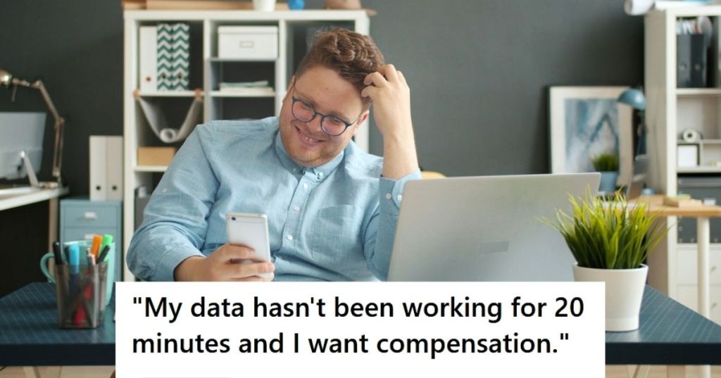 Man laughing at his desk