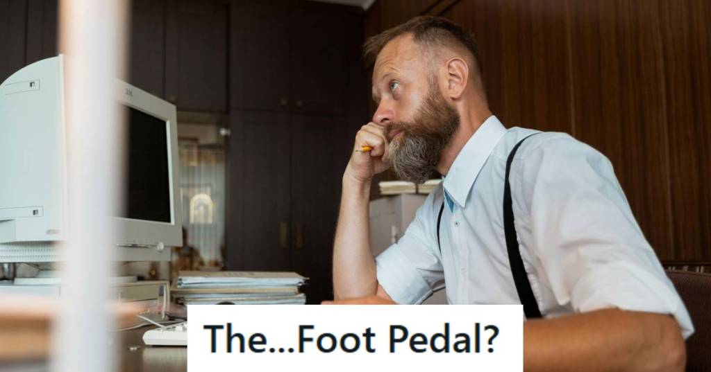 Man sitting at his desk trying to set up his new computer