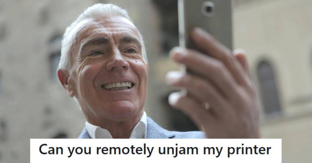 Man on a video call with his friend, helping unjam a printer remotely