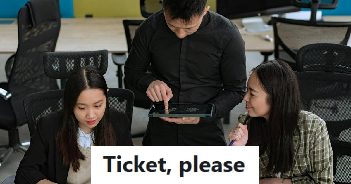 IT employee asking his two coworkers if they submitted tickets for their questions