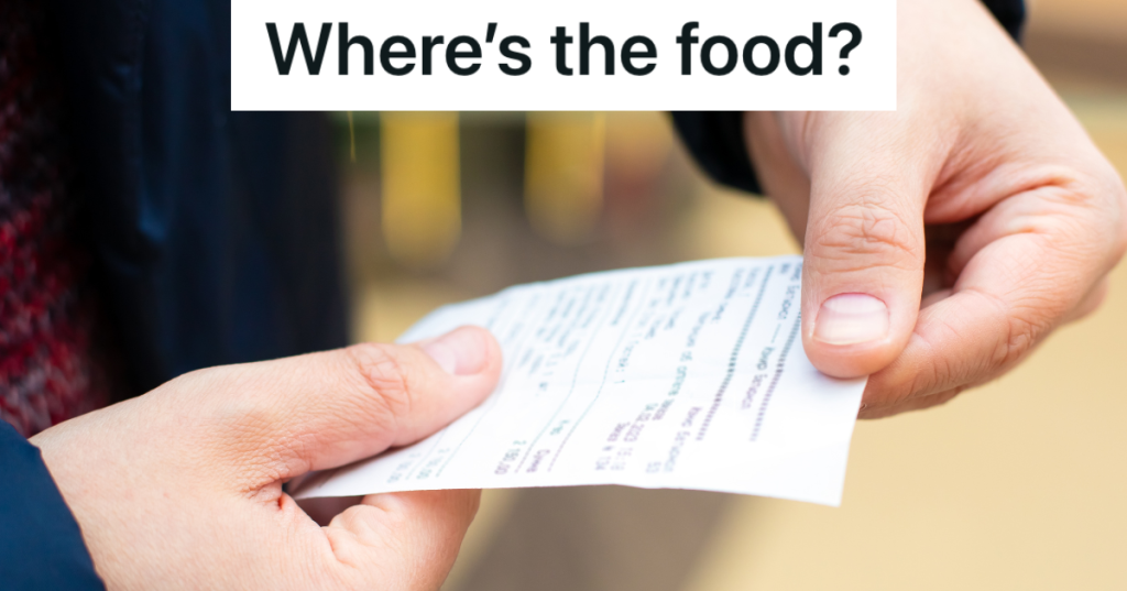 closeup of man holding receipt