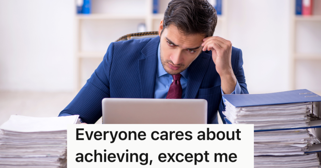 unhappy businessman with stacks of paperwork on his desk