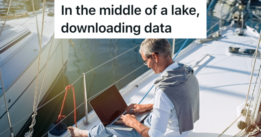 man on a boat with a laptop