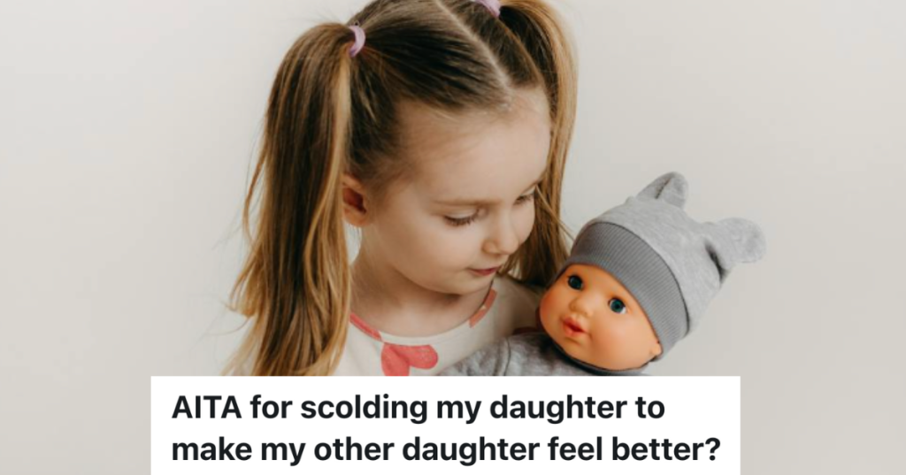 little girl holding a baby doll
