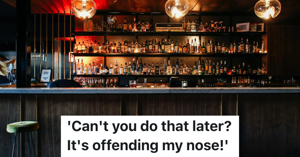 empty bar with bottles lines up on shelves behind the counter