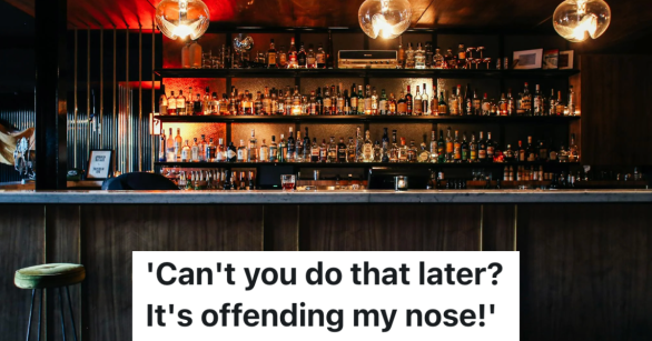 empty bar with bottles lines up on shelves behind the counter