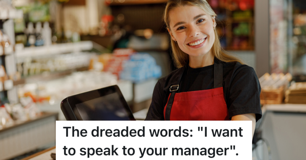 smiling cashier in red apron
