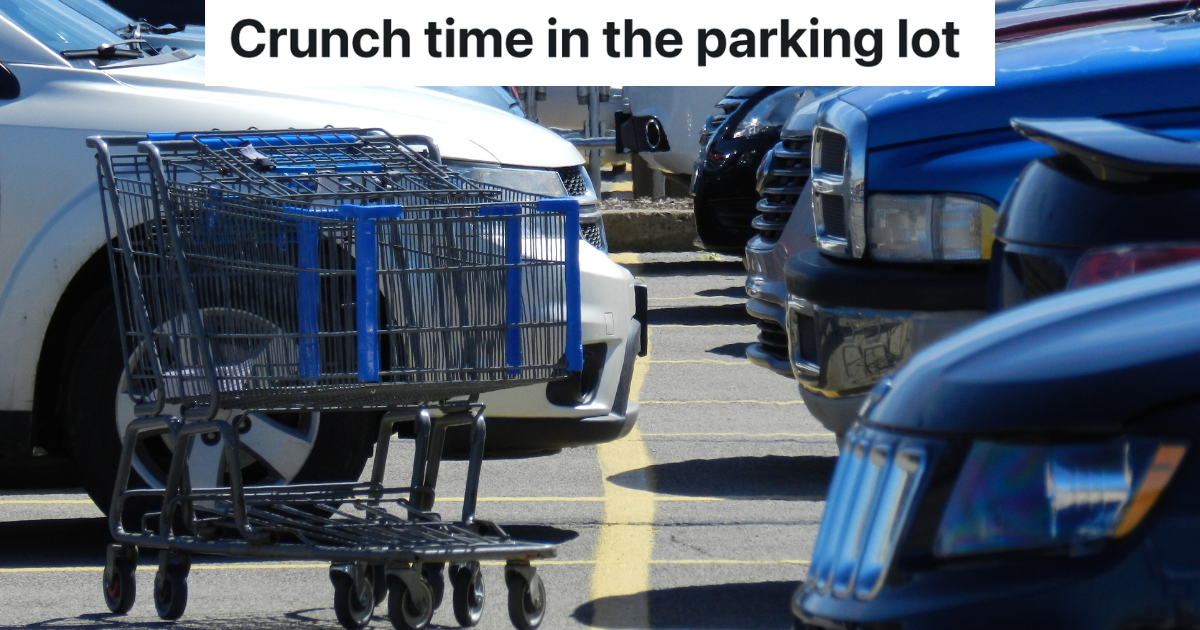Shopping carts in a parking lot with cars