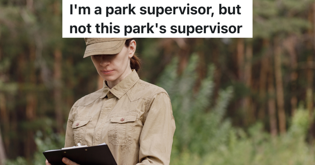 female park supervisor writing something in a book