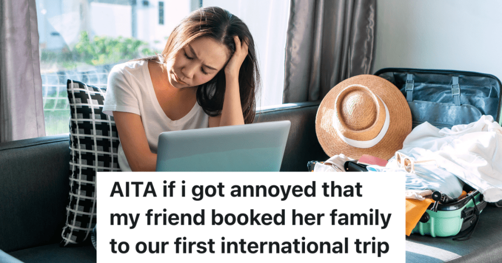 stressed out woman looking at computer next to open suitcase