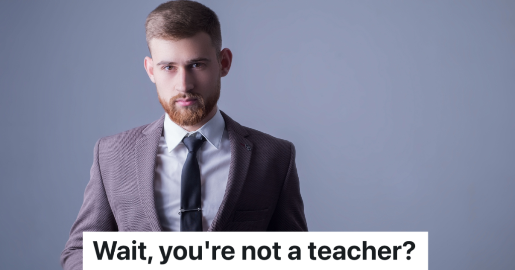 young man with a beard in a gray suit