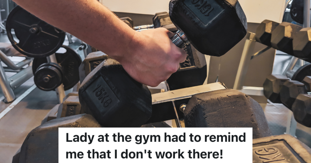 man's hand picking up weights at gym