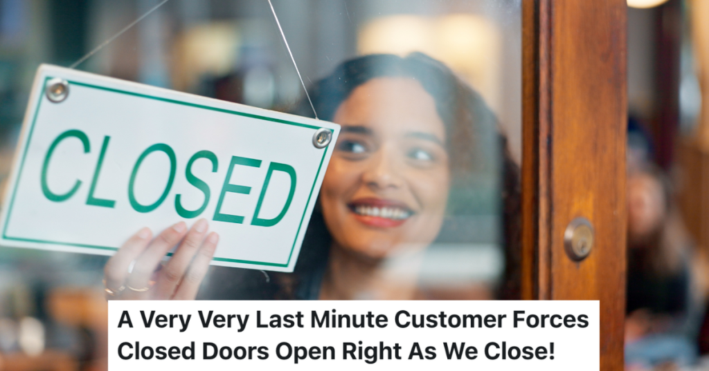 smiling woman putting closed sign in store window