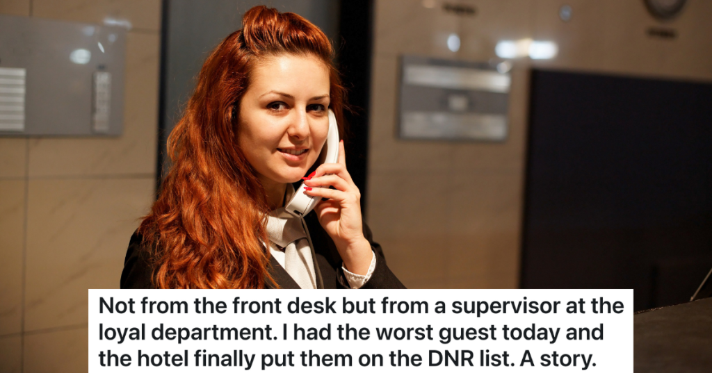 hotel supervisor on the phone at the front desk