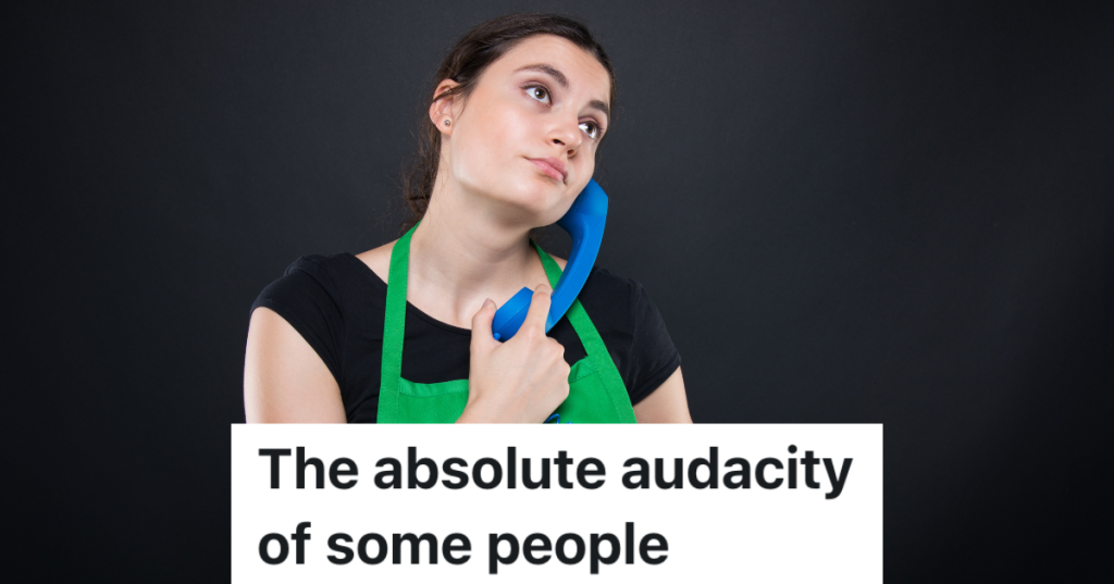 woman in green apron holding a blue telephone