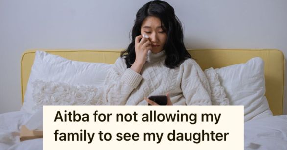 Young lady crying while looking at her phone