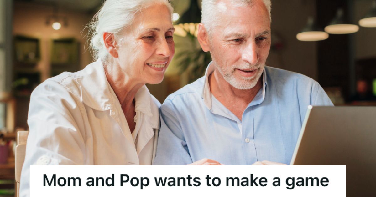 An elderly couple looking at a laptop smiling