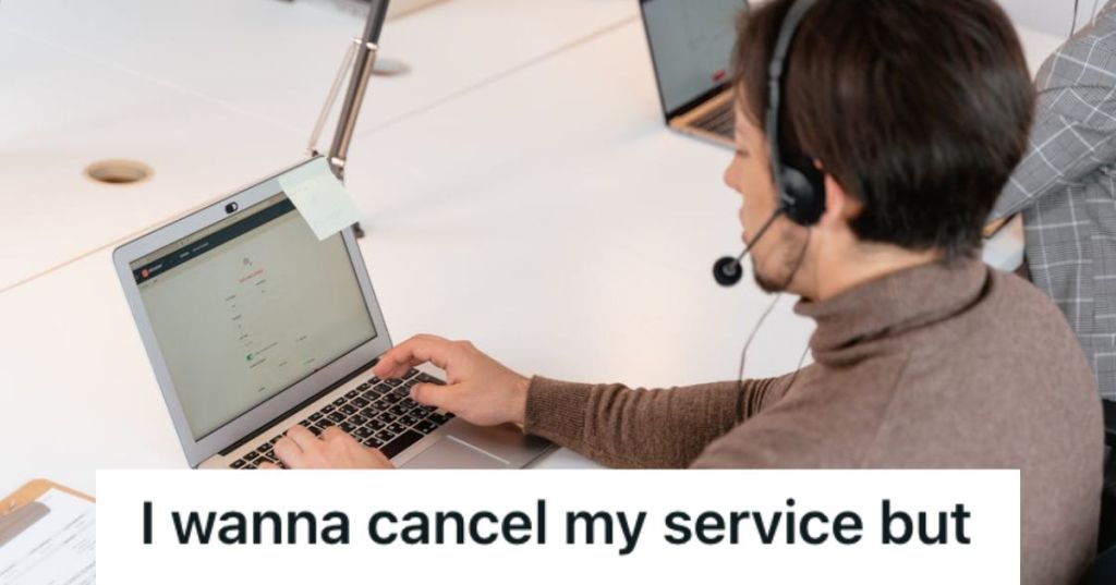 Employee wearing headset is working on his laptop