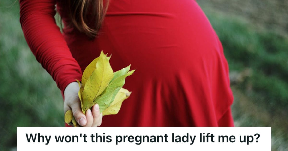 Pregnant woman wearing a red dress and holding leaves