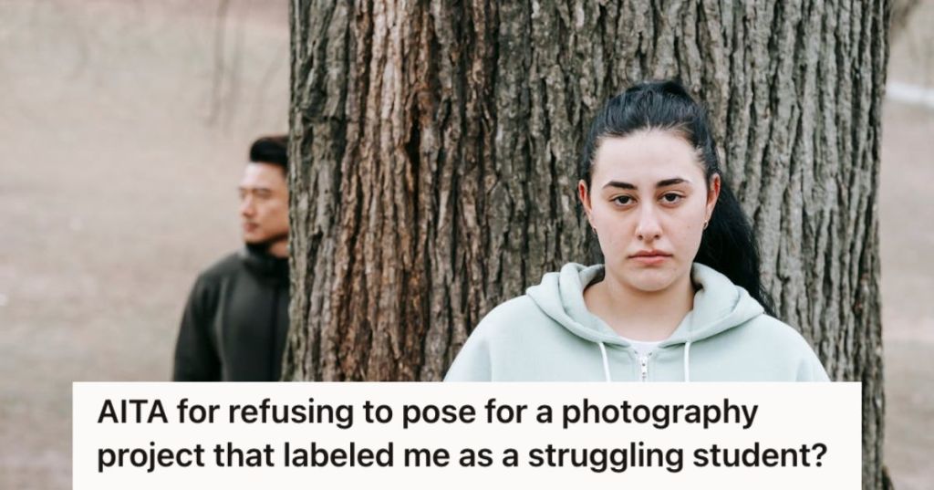 Woman with poker face standing by the tree