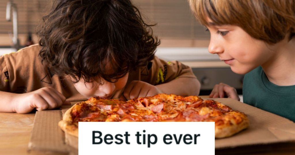 Kids eating pizza off a box