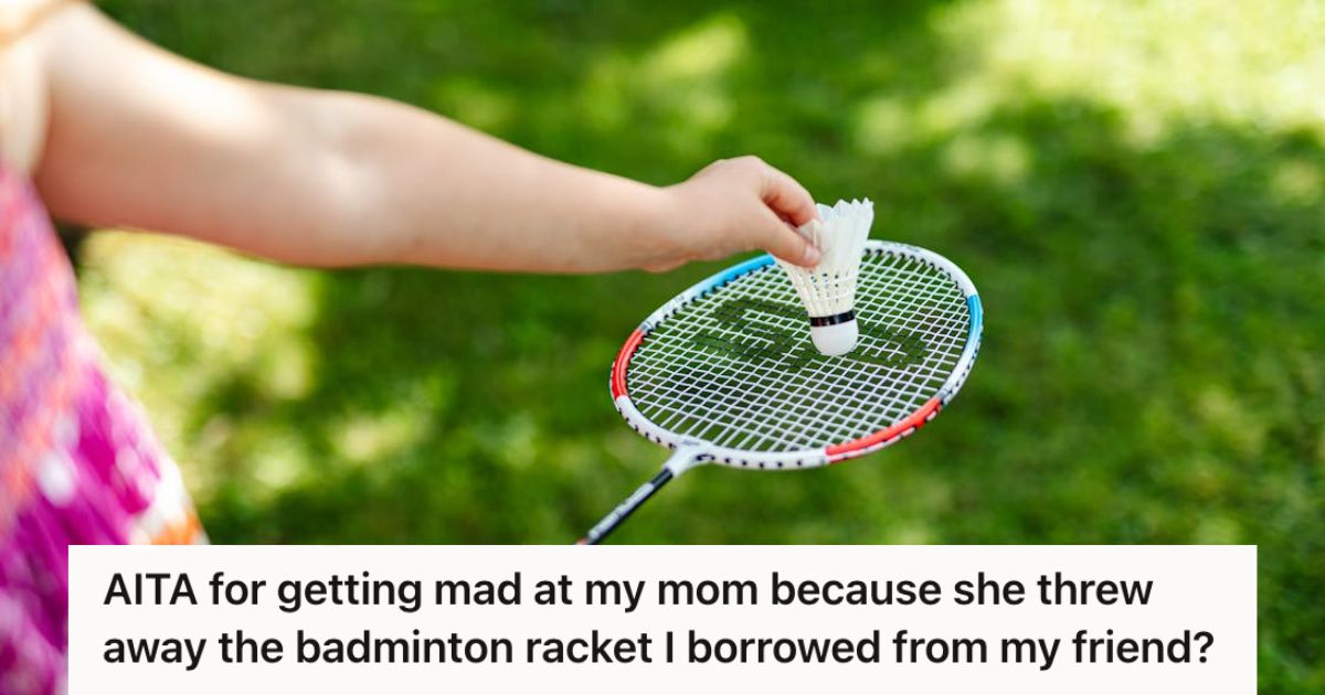 Girl holding a badminton racket ready to serve
