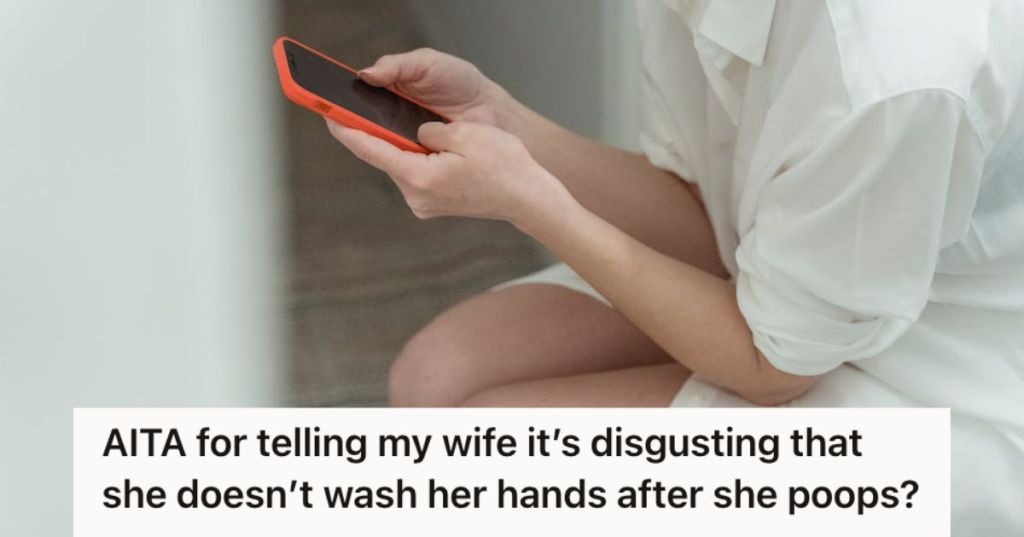 Woman on the toilet using her cellphone