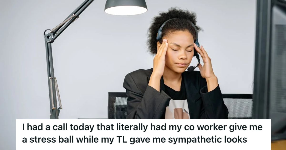 Stressed call center agent touching her head and closing her eyes