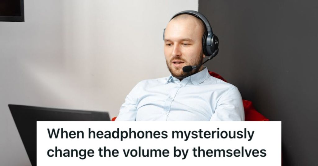 Man wearing headphones and using his laptop
