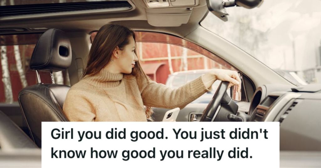 Woman holding her phone while driving