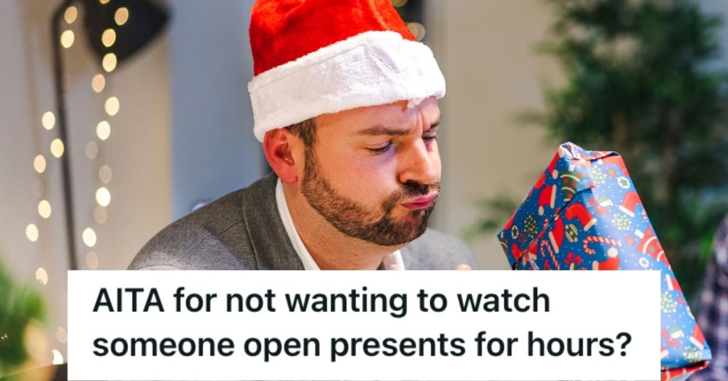 Man in Santa hat holding a Christmas gift