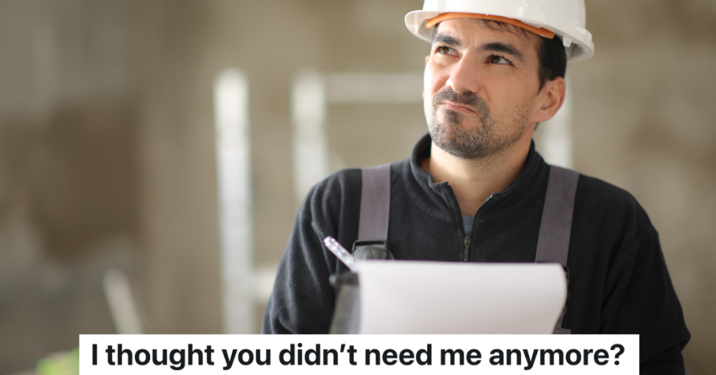 construction worker in a hardhat writing something down