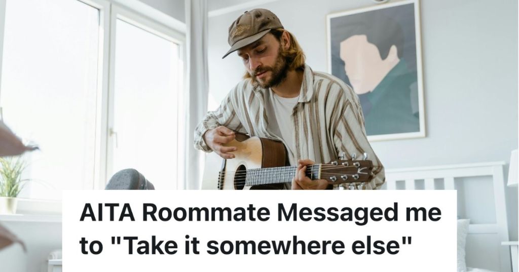 Man playing an acoustic guitar in a home