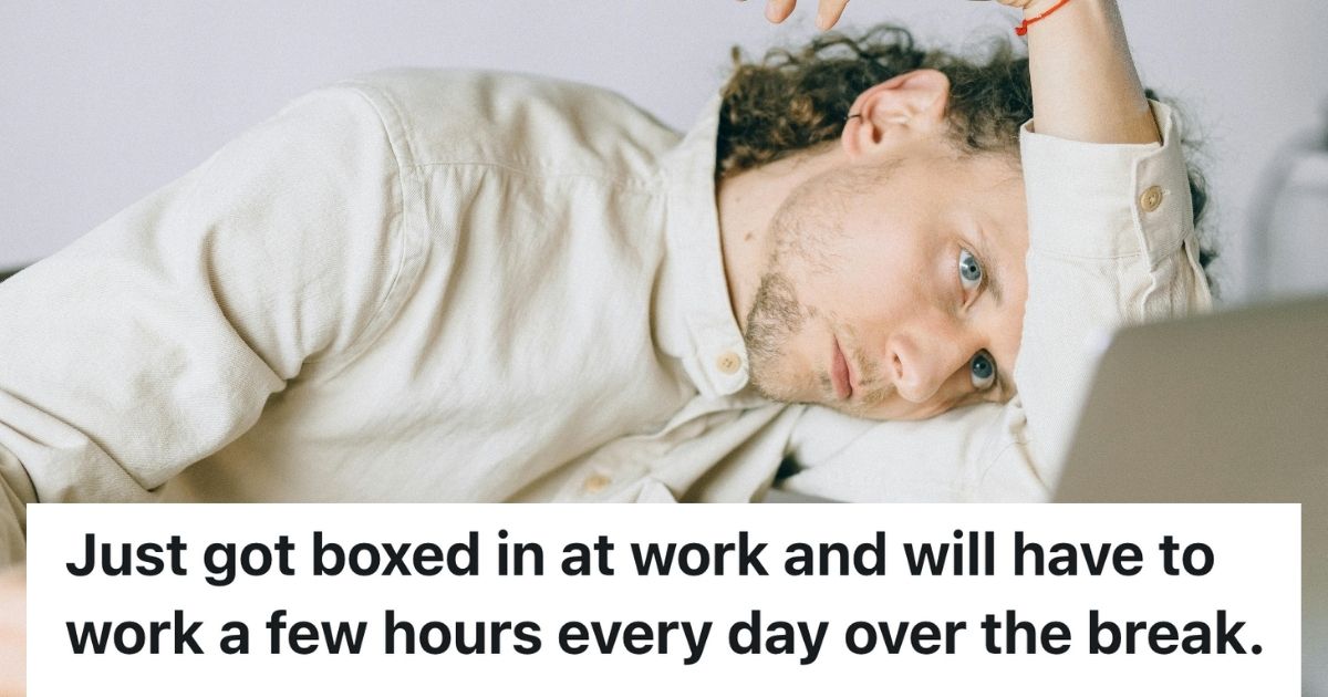 Man lying on his arm in front of laptop