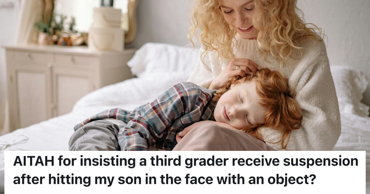 Woman stroking young boy's hair