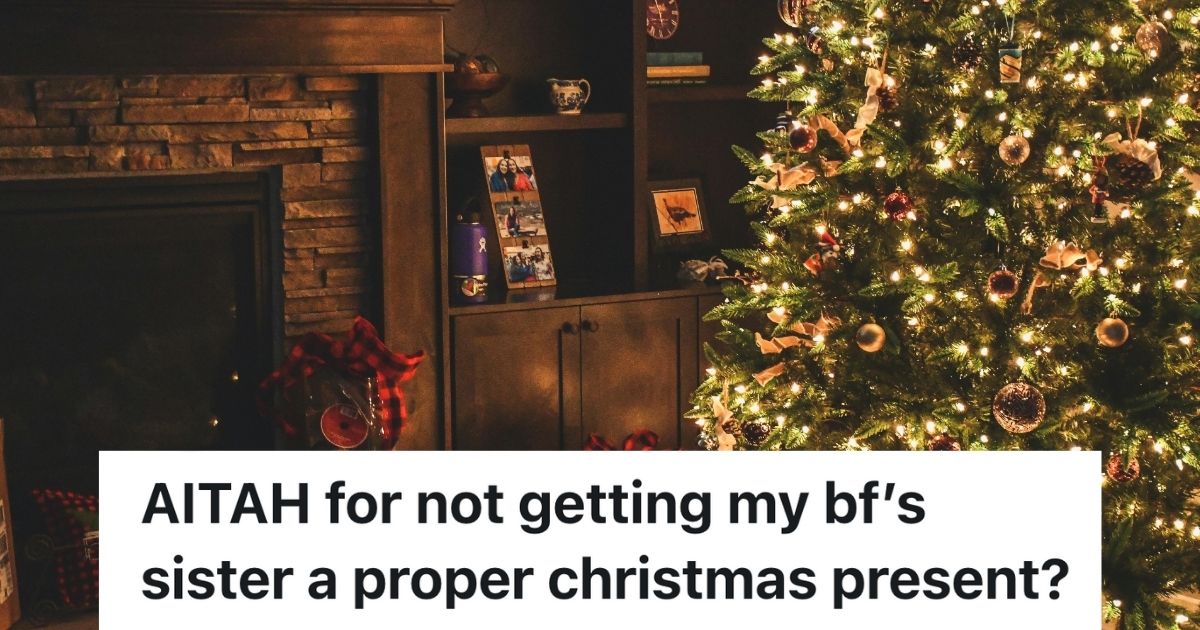 Young Woman Only Gave Her Boyfriends Sister A Chocolate Bar Because She Has Been Super Hostile, And His Family Is On Her Side Despite The Drama Lit up Christmas tree beside fireplace
