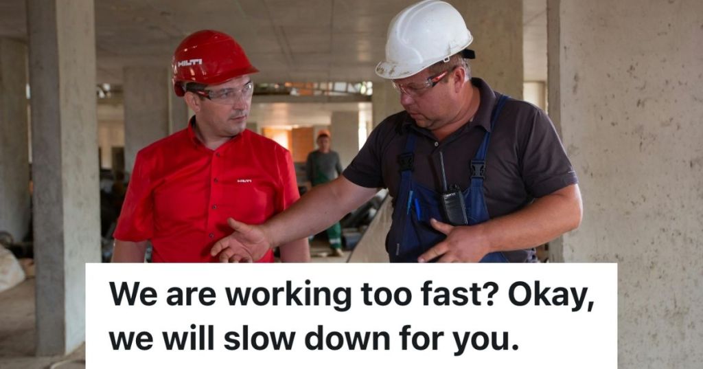 Two men talking, wearing construction hats
