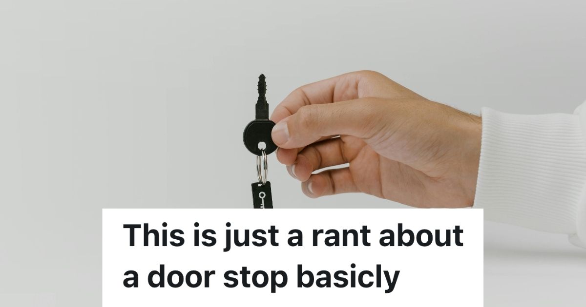 A hand holding a key