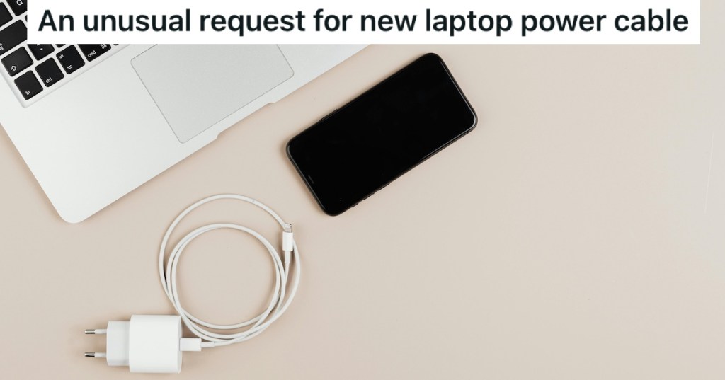 A laptop, a phone, and a charger cable