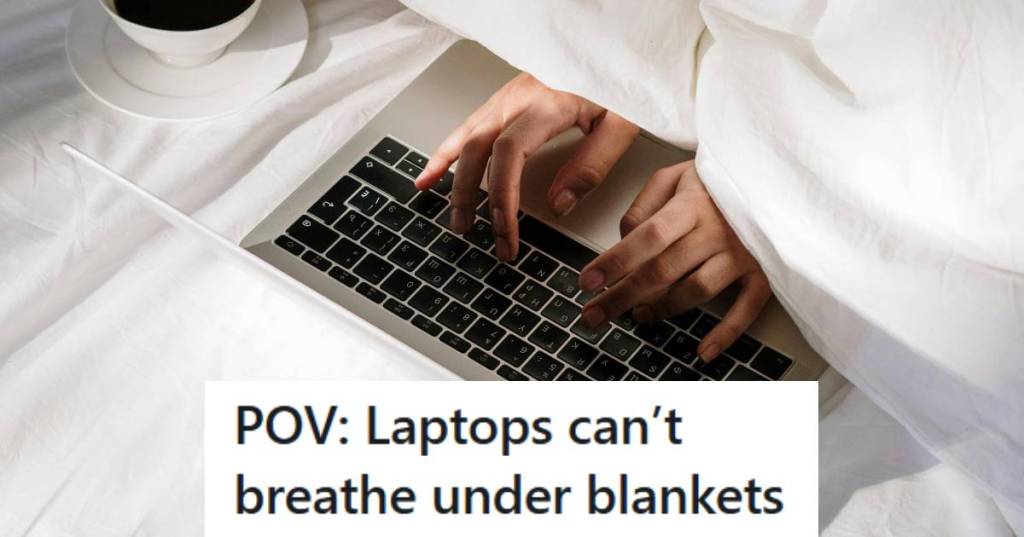 Woman using her laptop on the bed, under all the blankets