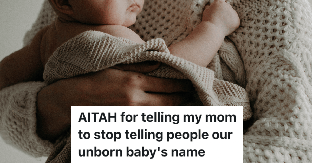 person in sweater holding a baby wrapped in a blanket.