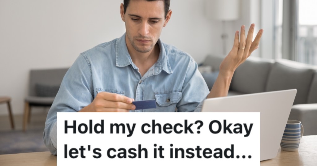 man looking at credit card