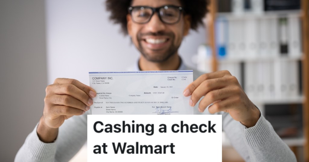 man holding a check
