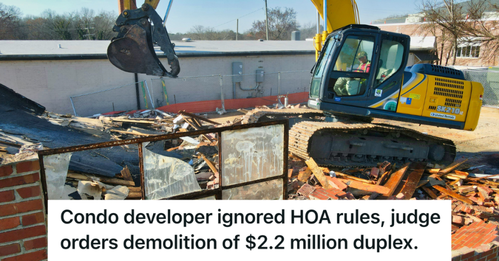 construction equipment demolishing a house