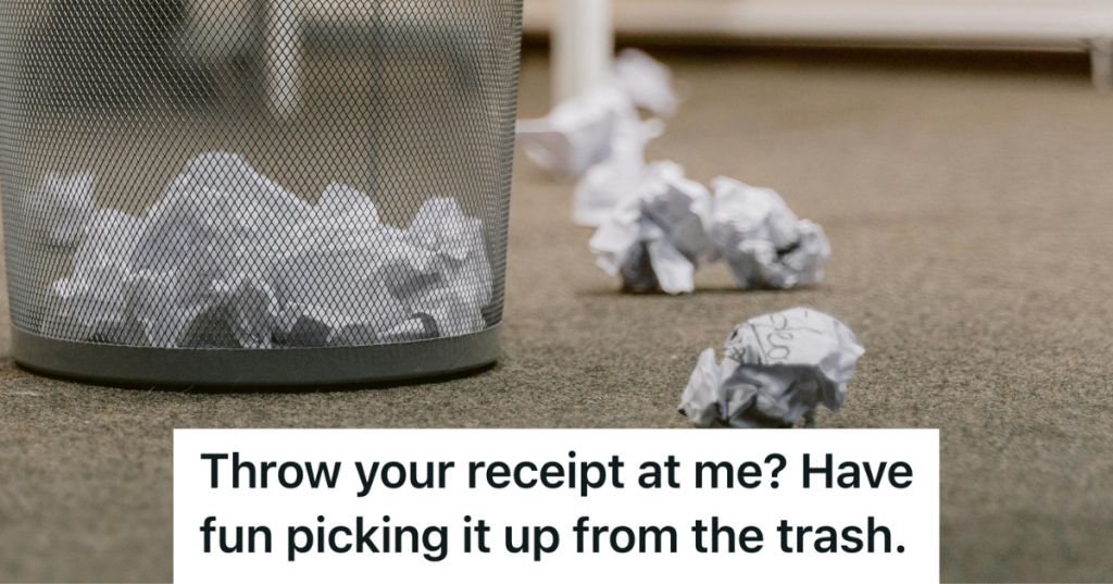 crumpled up paper next to trash bin